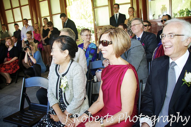 Family laughing during wedding ceremony - wedding photography sydney